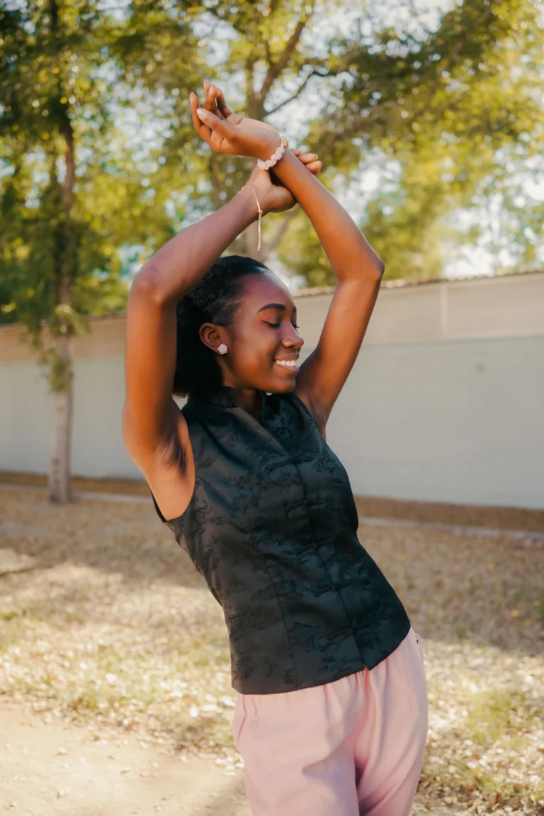 Arms raised showing the upper arm contour