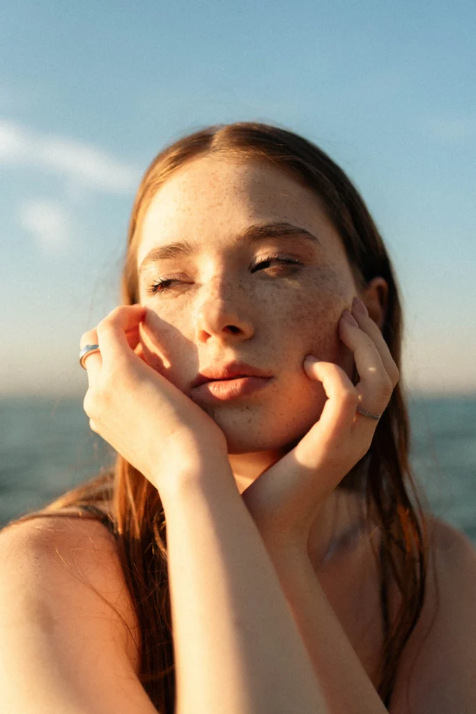 Woman in calm reflection representing private intimate surgery consultation