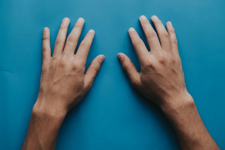 Both hands resting on a surface